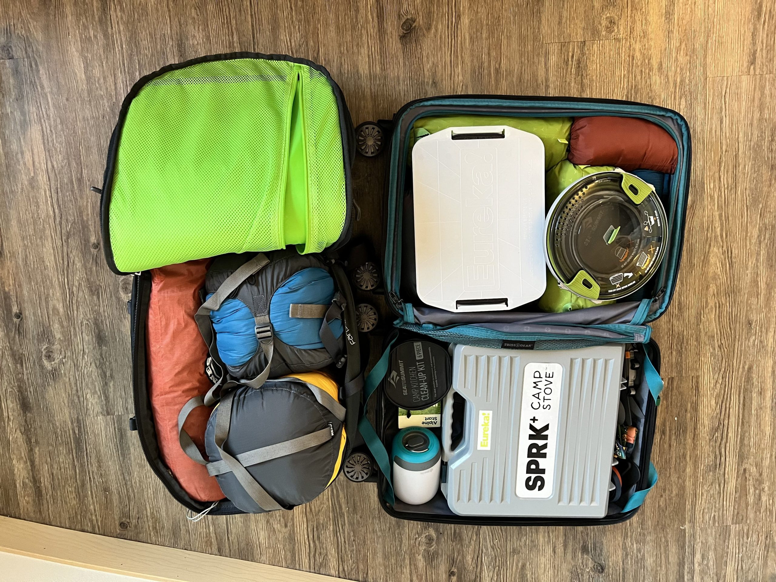 Carry on luggage packed with camping gear