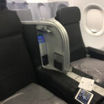 JetBlue Mint Class seat with a drink bottle