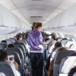 Interior of a modern passenger airplane with passengers
