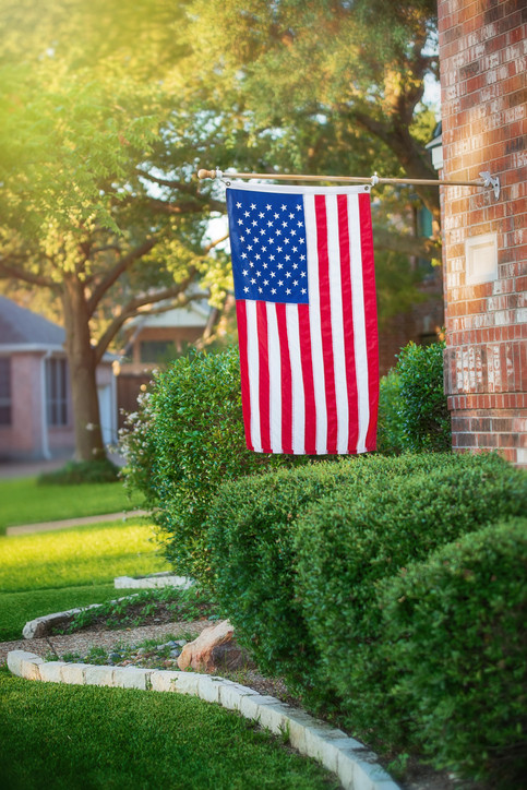 American Flag Displayed Vertically on a House