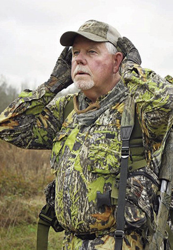 Turkey hunter using a call