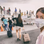 passenger in airport wearing a medical mask