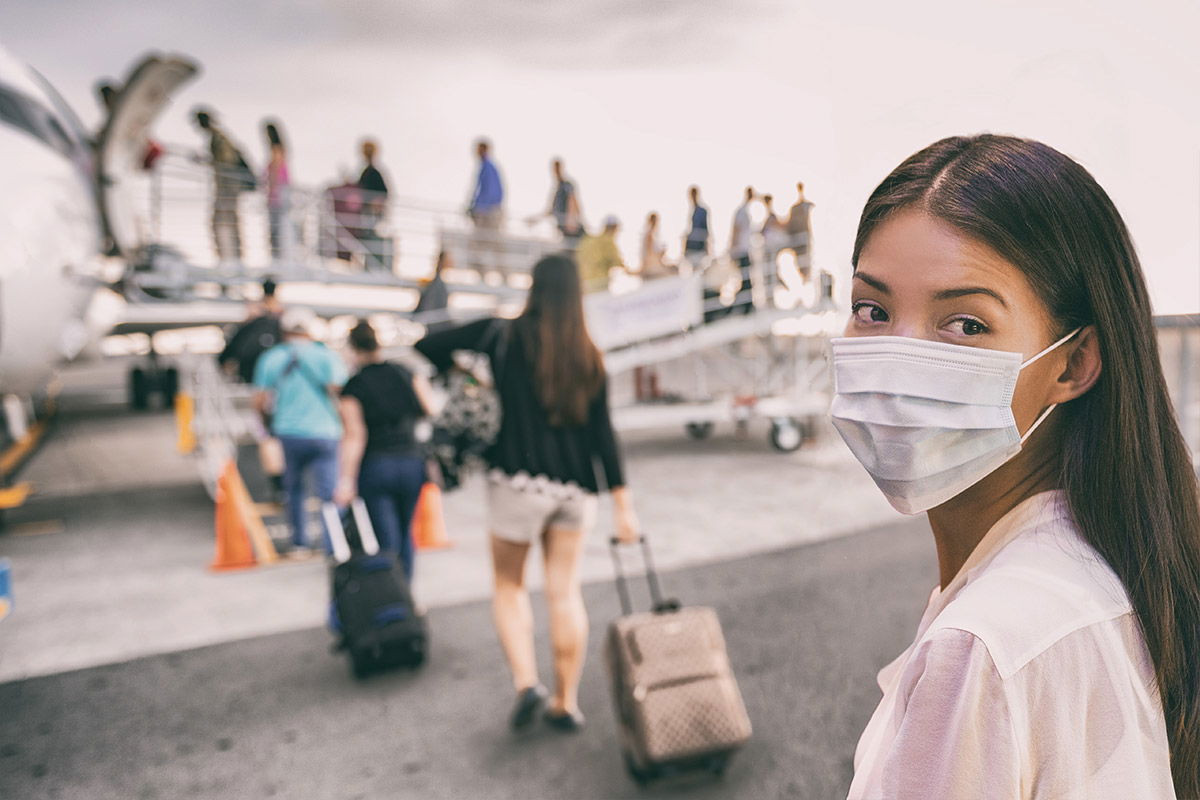 passenger in airport wearing a medical mask