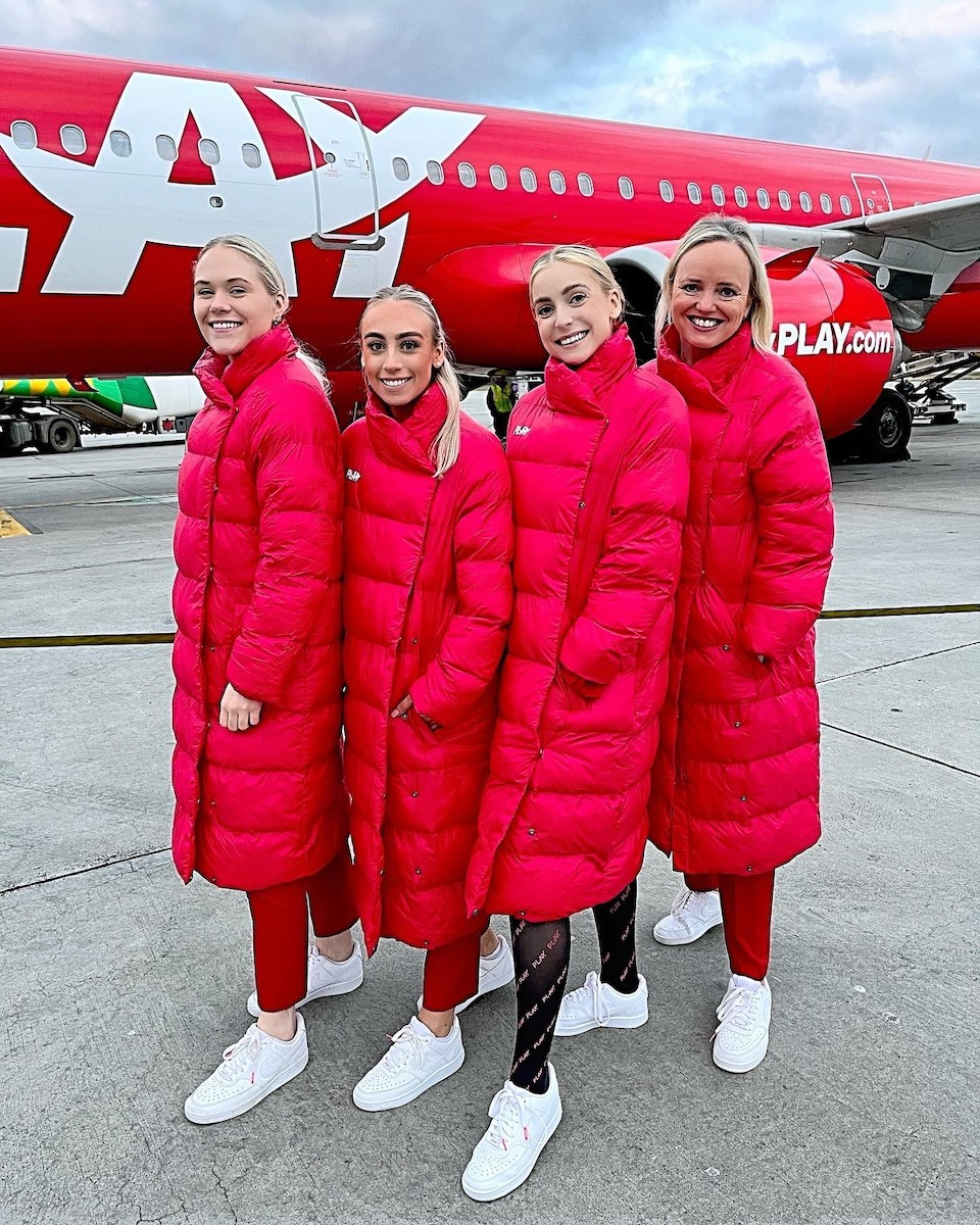 PLAY flight attendants providing in-flight service with a smile