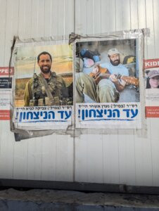 Posters in Tel Aviv, showcasing resilience, reflect ongoing challenges and the determination to continue.