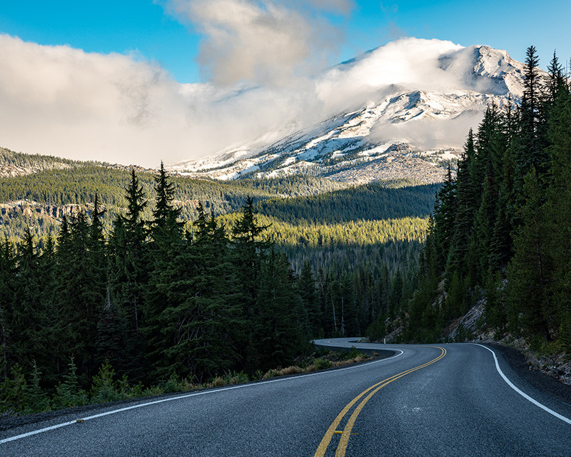 Driving through a scenic highway towards Bend, Oregon, highlighting the natural beauty of the region