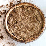 Overhead shot showcasing a freshly baked shoofly pie, highlighting its crumbly topping and rich filling