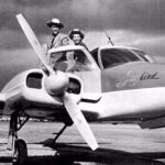 Sky King and Penny in front of their airplane