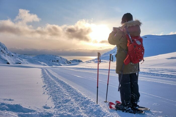A snowshoe winter hike in Sisimiut, Greenland showcasing winter activities