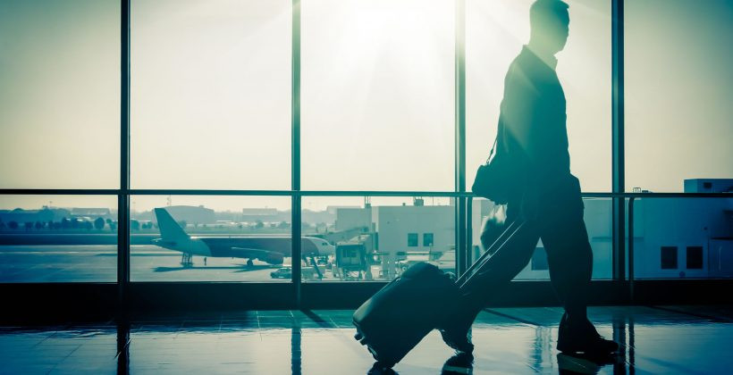 Man holding a garment bag