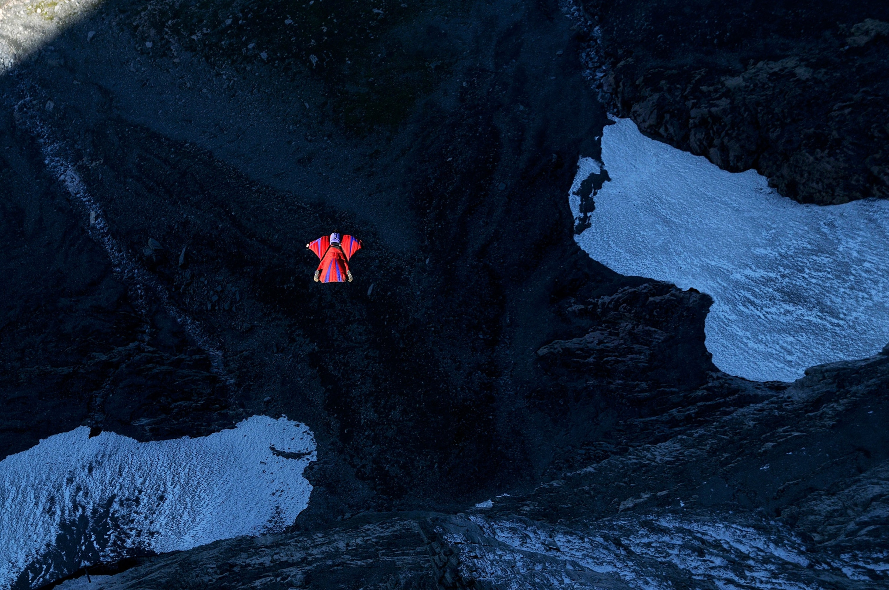 Wingsuit pilots preparing for a jump, emphasizing the importance of pre-flight checks and safety protocols
