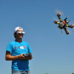 Pilot Controlling FPV Drone wearing FPV Goggles