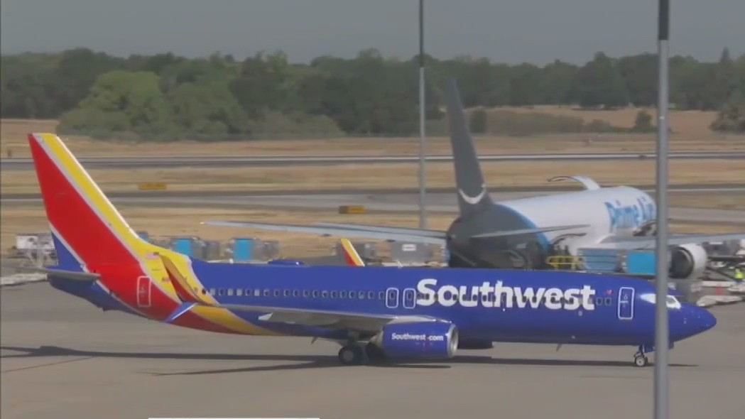 Southwest Airlines plane at the gate, showcasing their commitment to on-time performance and safety