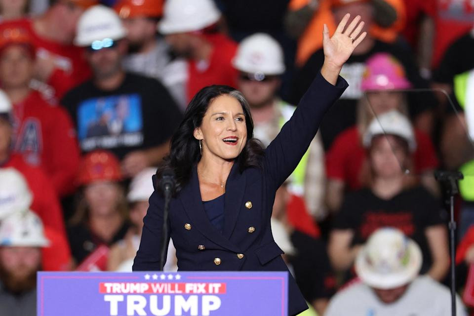 Tulsi Gabbard waves at a Donald Trump rally