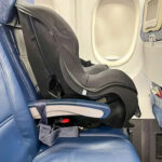 Car seat on airplane window seat